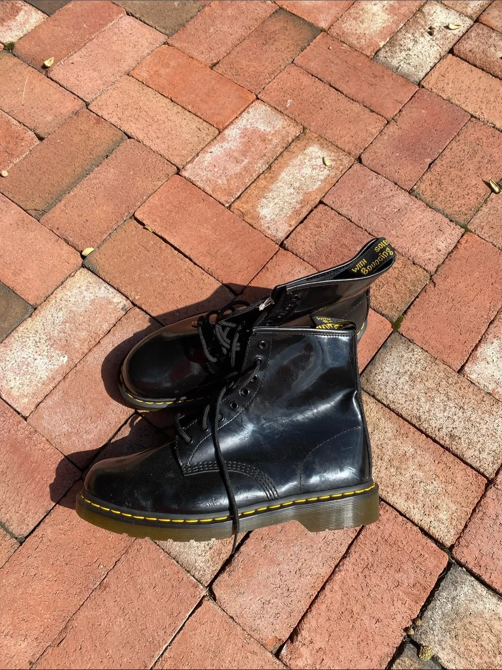 Dr. Martens Black Leather 8-Eye Lace-Up Boots with Yellow Stitching